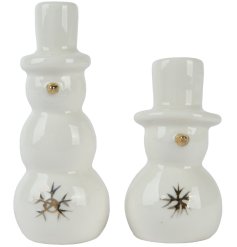 Bring home the magic of a white Christmas with our charming Snowman Porcelain 
