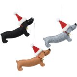 A fun dog wearing xmas hat hanging tree deco