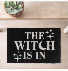 A cool and quirky doormat in black with witch associated wording and sparkle annotations. 