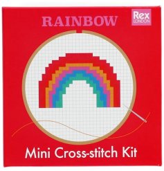 A cross-stitch kit showcasing a rainbow design,