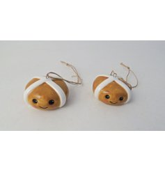 A super adorable hot cross bun hanger featuring a smiley face and a jute hanger.