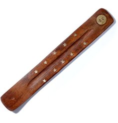 A lovely carved wooden incense stick tray adorned with golden stars and a patterned symbol at one end