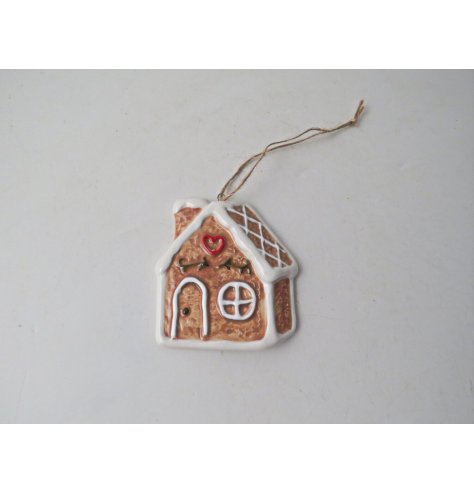 Deck your tree with holiday spirit using this adorable gingerbread house for a touch of tradition