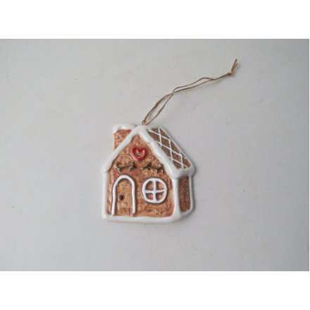 Deck your tree with holiday spirit using this adorable gingerbread house for a touch of tradition