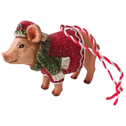 Add some playful charm to your tree with this cheeky pig ornament. A must-have for a festive touch of whimsy. 