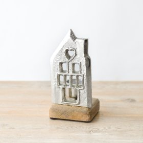 Illuminate your home with the stylish and elegant House On Base candle holder. 