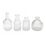 Set of 4 clear vases are made from clear transparent patterned glass. 