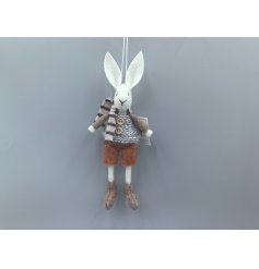 A chic boy rabbit hanging rabbit decoration in neutral colours. 
