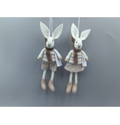 An assortment of 2 hanging rabbit decorations in cream and brown colours, wearing a min striped scarf.