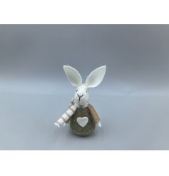 This charming little rabbit dressed in earthy tones would look adorable anywhere in the home. 