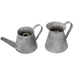 Say goodbye to dull decor and welcome charm and elegance with our stunning Watering Can Candle Holder. 