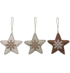 An assortment of 3 fabric star decorations with large stitched detailing and a snowflake motif.