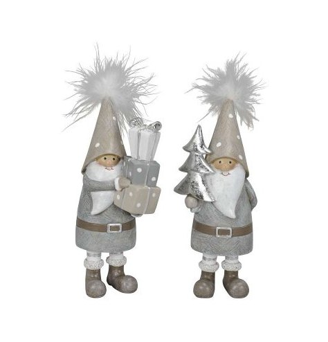 Two tall gnomes with feather pom poms, one with a tower of gifts and one with a silver tree.