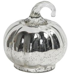 Elevate your Halloween decor with this radiant silver pumpkin ornament