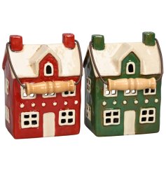Bring a touch of festive charm to your home with our Two Assorted House Lanterns. 