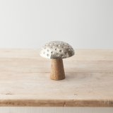 A cute mushroom decoration with metal and mango wood design and 3D dot detailing. 
