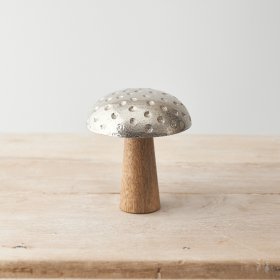 A cute mushroom decoration with metal and mango wood design and 3D dot detailing. 