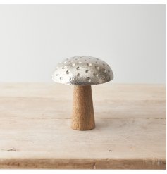 A sweet mushroom decoration made from mango wood and metal with 3d spot design. 