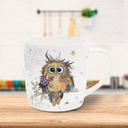This delightful mug features a whimsical illustration of a wise owl, designed by the renowned Bug Art. 
