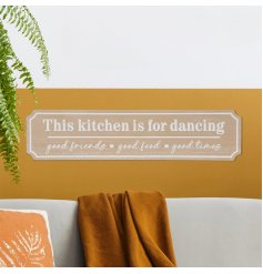 This plaque celebrates the joy of cooking, entertaining and dancing with loved ones.
