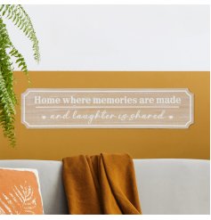 Cherish your most treasured moments with our 'Home where memories are made and laughter is shared' plaque.