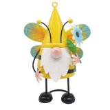 This gnome is dressed as a bumblebee and features a flower.
