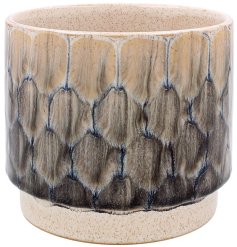 Introducing our stunning reactive glaze plant pot in a stylish grey shade, perfect for adding a touch of natural tone
