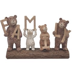 A collection of bears holding 'family' letters whilst stood on a rock. 