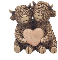 Bring a touch of Scottish countryside charm into your home with Hughie the Highland cows True Love resin ornament.