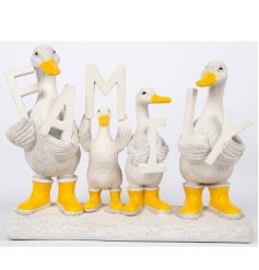 A delightful family of ornamental ducks each holding a letter of the word 'Family' complete with yellow wellingtons. 