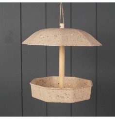 Made from coffee husks, a bird feeder designed for filling with mealworms. 