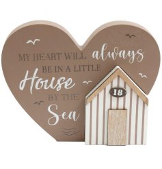 A simplistic neutral heart shaped plaque with scripted text and a 3D house removable block.