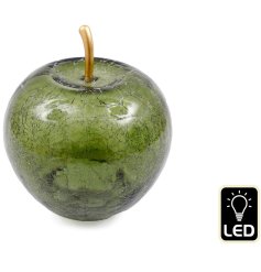 A chic glass apple ornament with a LED light inside.