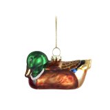 A glass Christmas tree decoration in the shape of a duck. 