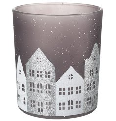 Add a touch of whimsical winter wonderland to your holiday decor with our Snowy House Scene T-light Holder. 
