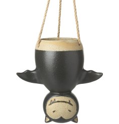 A unique ceramic bat shaped planter with chunky rope hangers.