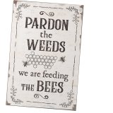 Pardon the weeds we are feeding the bees. A rustic bee themed sign for the garden. 