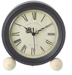 A vintage design clock with ball feet in clean and classic design.