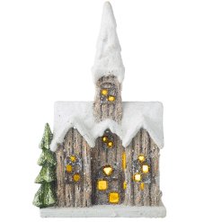 A stylish ceramic led house decoration with a snowy finish perfect for xmas