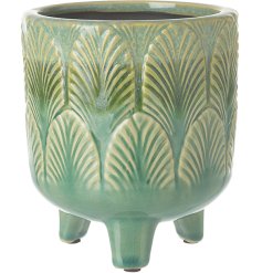 A stylish planter with a rich green glaze and leaf design. The perfect way to present house plants. 