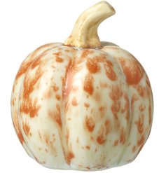 A chic ceramic pumpkin decoration with a burnt orange reactive glaze.