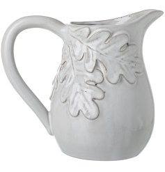 A stylish jug with a white glaze and oak leaf design. A statement tableware item this season. 