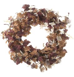 A large rustic wreath created with an abundance of rich tonal leaves in earthy brown and purple colours.