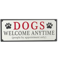 A fun metal sign with the phrase "Dogs welcome anytime, people by appointment