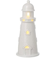 A lovely white glazed lighthouse decoration with warm white LED's fitted inside. 