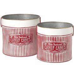 These durable metal buckets come in a striking red and white design, reminiscent of traditional candy canes
