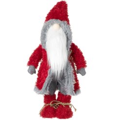 A tall standing Santa decoration wearing a red and grey jacket.
