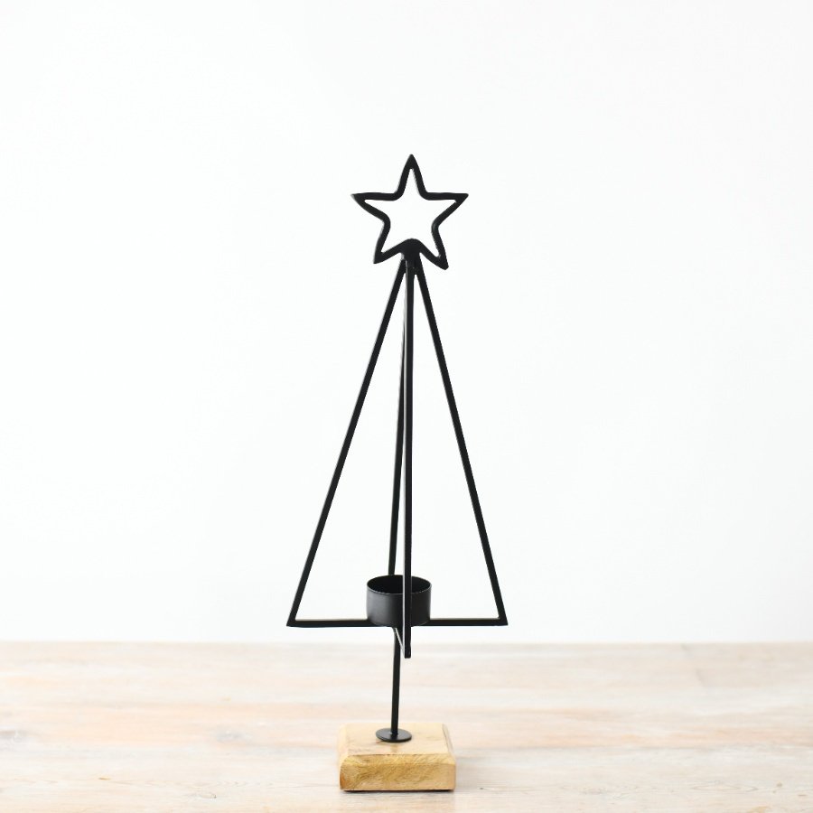 Elevate the festive charm this holiday season with a darling tree-shaped candle holder featuring a star on top.