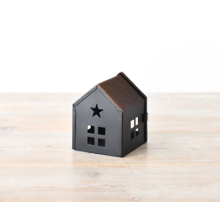 Bring a touch of whimsy to your space with our charming House 10cm.