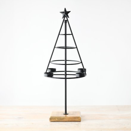 Add a touch of festive charm to your living room with this elegant tabletop candle holder in the shape of a Christmas tr